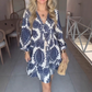 Damenmode-Minikleid mit V-Ausschnitt und Print