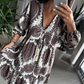 Damenmode-Minikleid mit V-Ausschnitt und Print